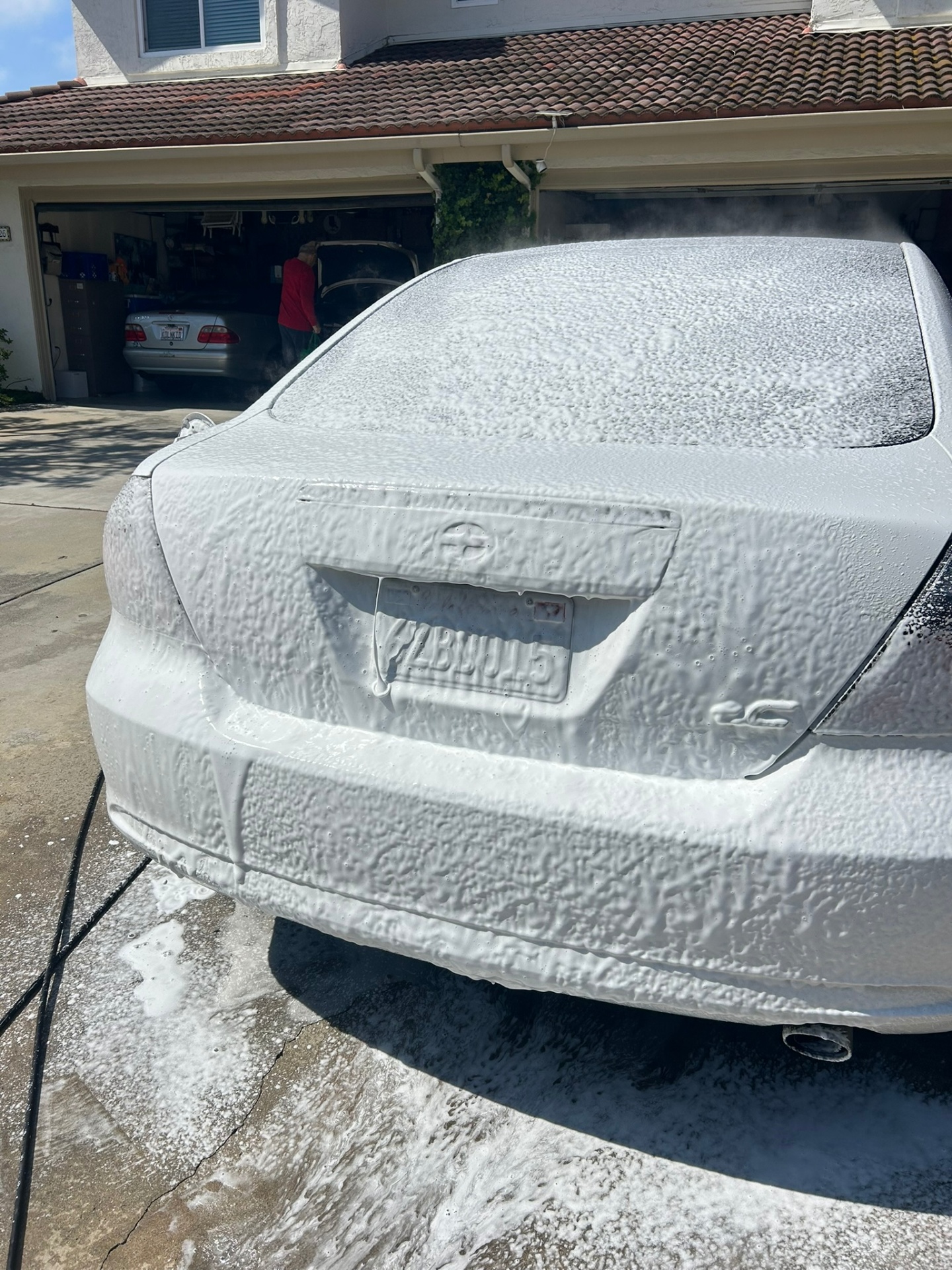 Foam bath and two-bucket exterior hand wash in progress